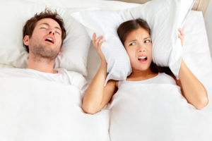 man snoring keeping his partner awake