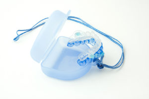 Medical mouthpiece on a white background. This mouthpiece helps to stop snoring.