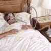 woman using cpap machine