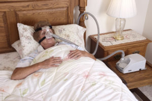 woman using cpap machine